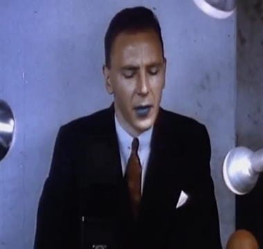 1939 An announcer made up for television