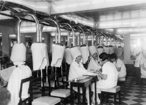 Women under hair dyers in the Rue Cambon salon