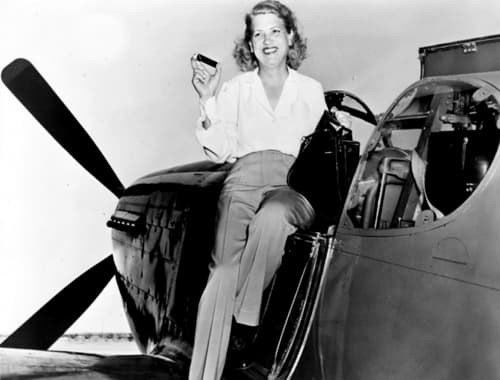 Jacqueline Cochran holding a Perk-Up Stick